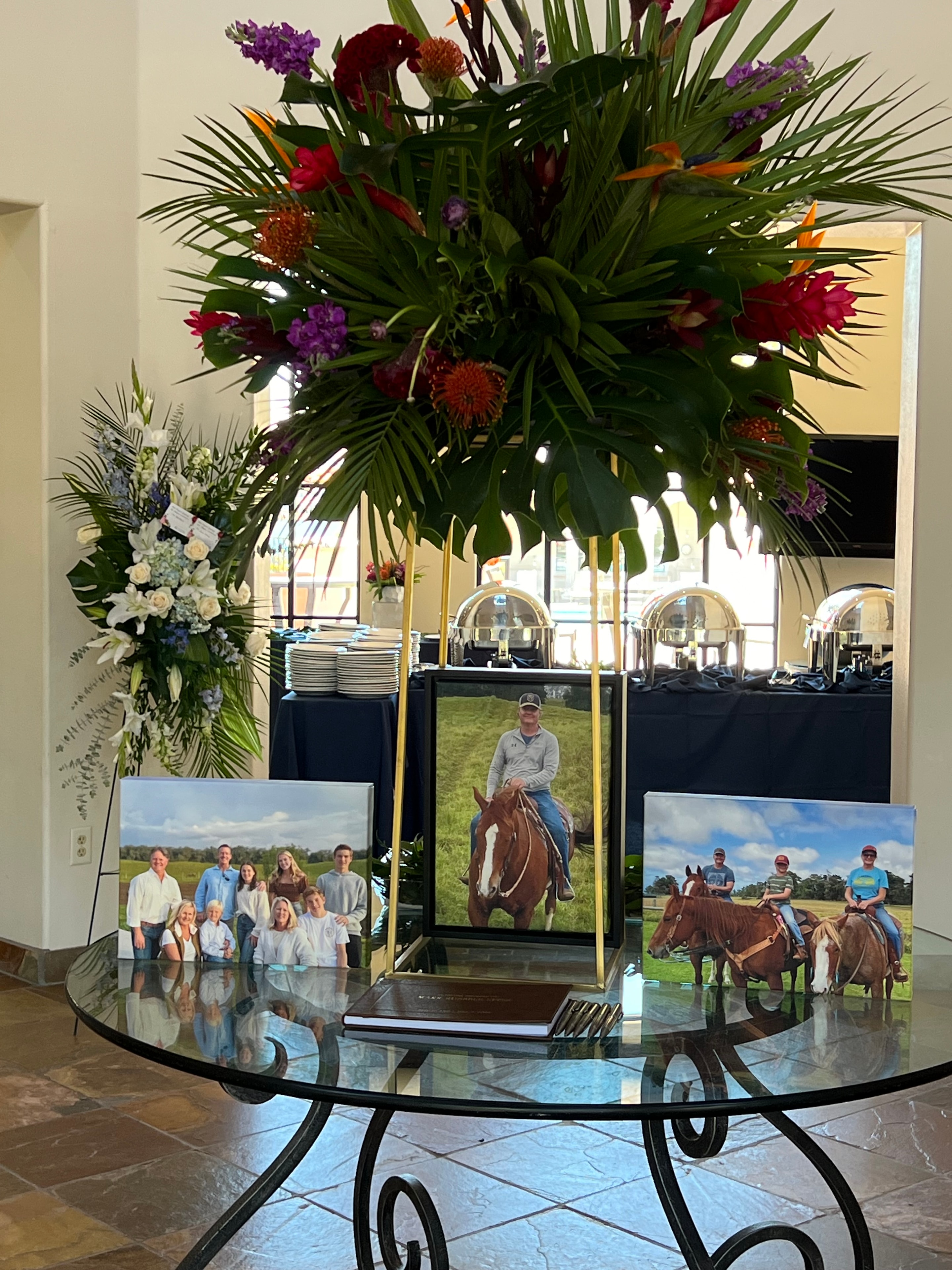 Heartfelt celebration of life with tropical florals and memorial tribute display